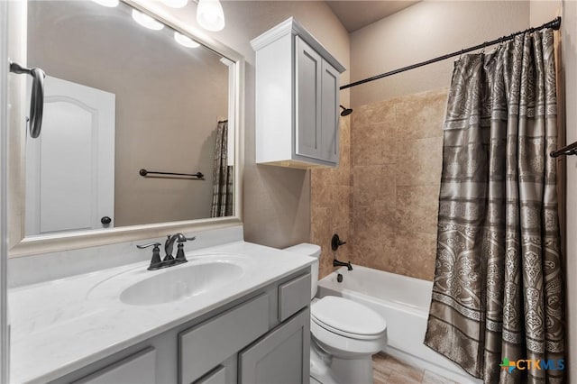 bathroom with shower / tub combo, vanity, and toilet