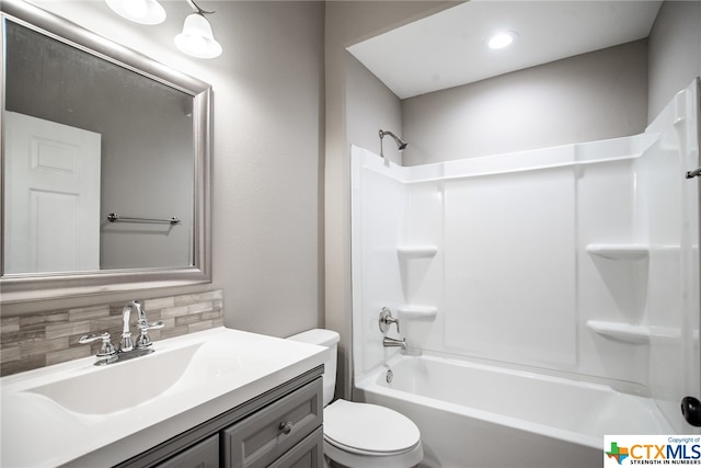 full bathroom with decorative backsplash, vanity, toilet, and shower / bathtub combination