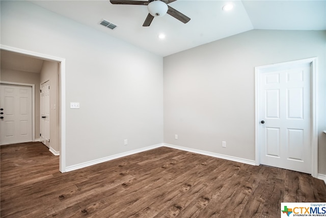 spare room featuring dark wood-type flooring, ceiling fan, and lofted ceiling