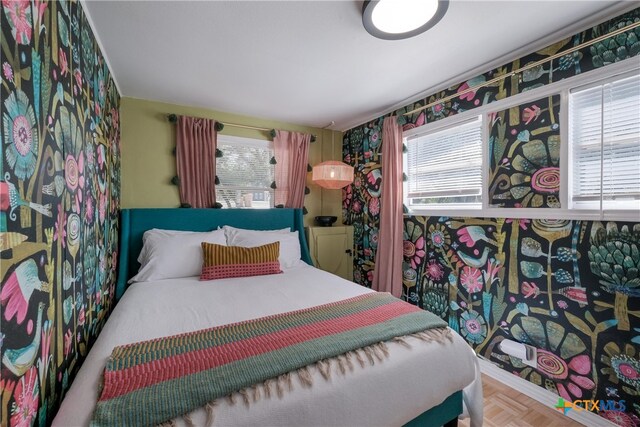 bedroom with wallpapered walls