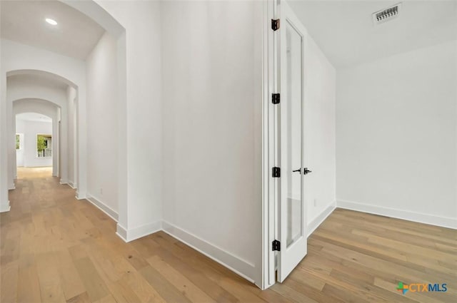 hallway featuring light hardwood / wood-style flooring