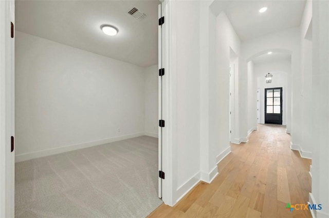 hallway featuring light hardwood / wood-style flooring