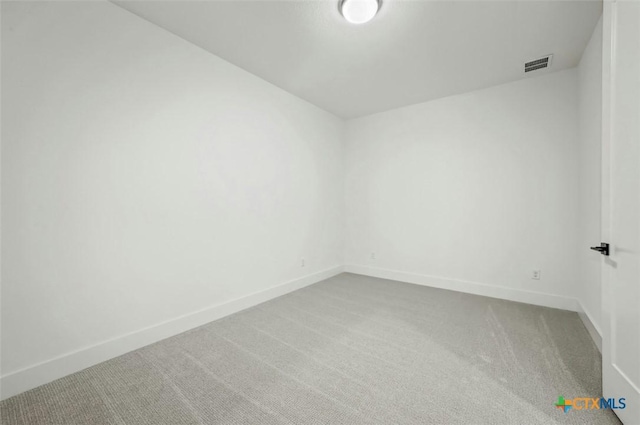 empty room featuring carpet flooring