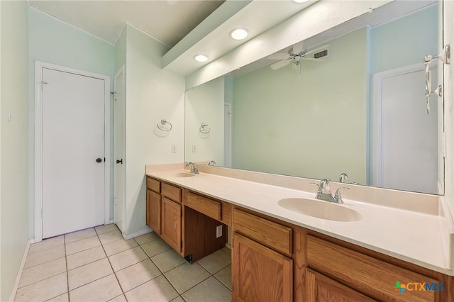 full bathroom with a sink, double vanity, ceiling fan, and tile patterned floors