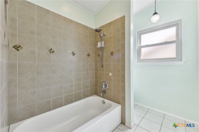 bathroom featuring tile patterned floors, baseboards, and shower / washtub combination