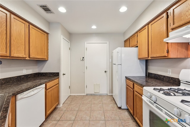 kitchen with visible vents, under cabinet range hood, recessed lighting, white appliances, and light tile patterned flooring