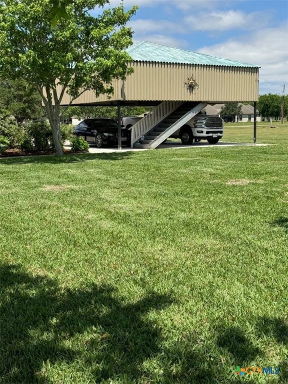 507 Hackberry Bnd, Port Lavaca, TX 77979 - view of parking with a detached carport