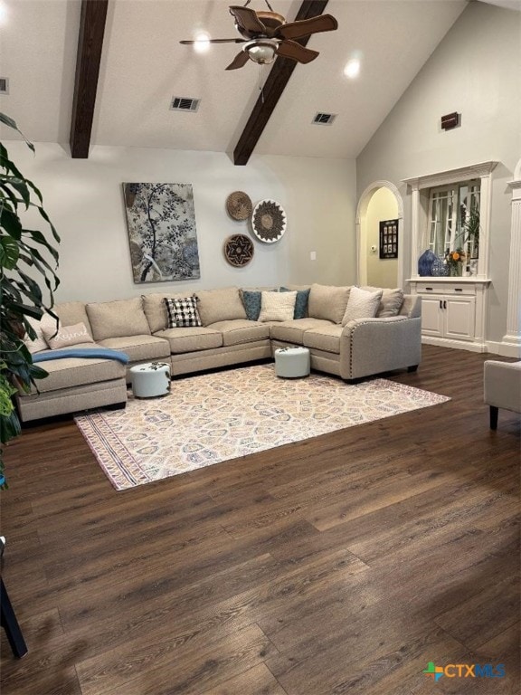 507 Hackberry Bnd, Port Lavaca, TX 77979 - living area featuring a ceiling fan, arched walkways, dark wood finished floors, high vaulted ceiling, and beamed ceiling