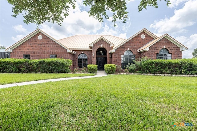 507 Hackberry Bnd, Port Lavaca, TX 77979 - view of front of property featuring brick siding and a front yard
