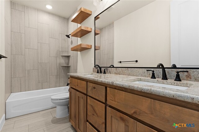 4231 Cold Springs Dr, Copperas Cove, TX 76539 - bathroom with bathing tub / shower combination, a sink, double vanity, and toilet