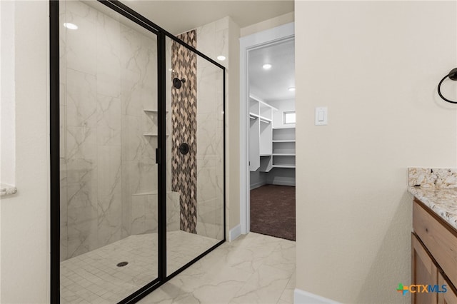 4231 Cold Springs Dr, Copperas Cove, TX 76539 - full bathroom featuring a marble finish shower, baseboards, a spacious closet, marble finish floor, and vanity