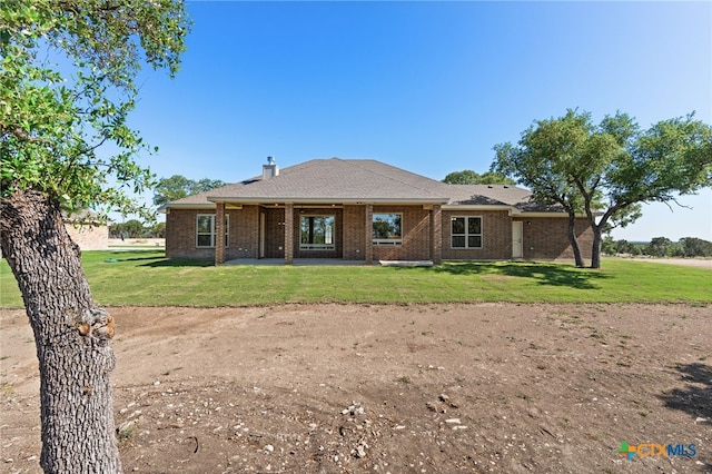 4231 Cold Springs Dr, Copperas Cove, TX 76539 - back of house with brick siding, a patio area, and a lawn
