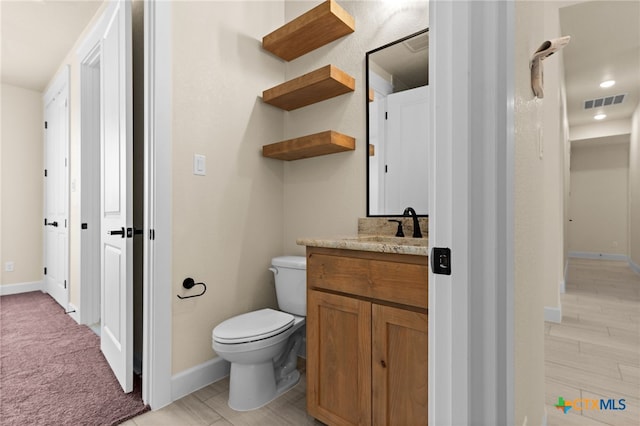 4231 Cold Springs Dr, Copperas Cove, TX 76539 - bathroom featuring visible vents, toilet, baseboards, and vanity