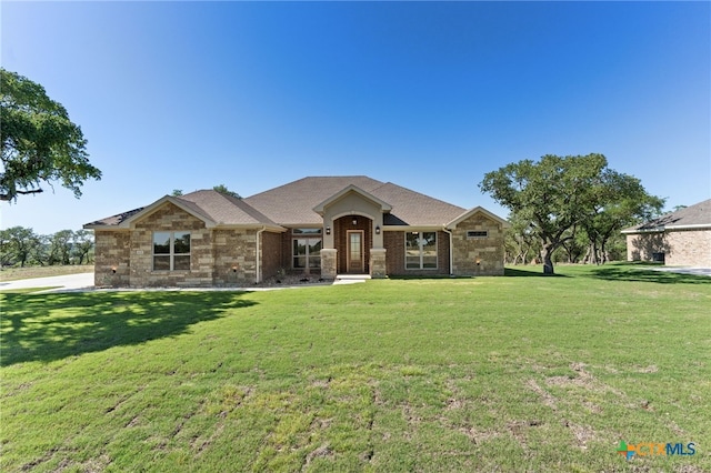 4231 Cold Springs Dr, Copperas Cove, TX 76539 - view of front of house with brick siding, a shingled roof, and a front yard