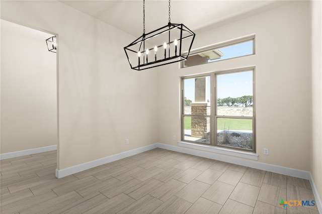 4231 Cold Springs Dr, Copperas Cove, TX 76539 - unfurnished dining area with baseboards, a notable chandelier, and wood tiled floor
