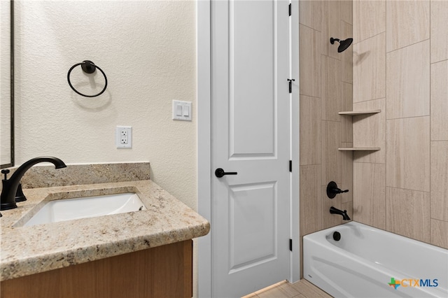 4231 Cold Springs Dr, Copperas Cove, TX 76539 - bathroom featuring a textured wall, vanity, and bathing tub / shower combination