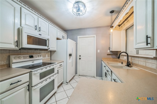 kitchen featuring decorative light fixtures, white cabinetry, white appliances, and decorative backsplash