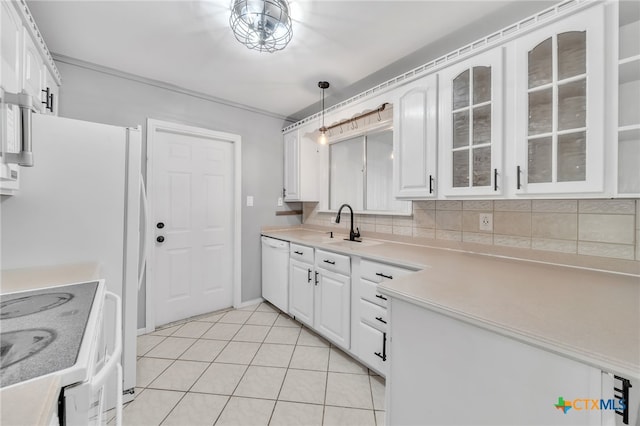 kitchen featuring hanging light fixtures, light tile patterned floors, backsplash, white cabinetry, and white appliances