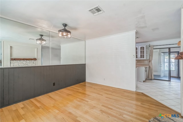 spare room featuring light wood-type flooring