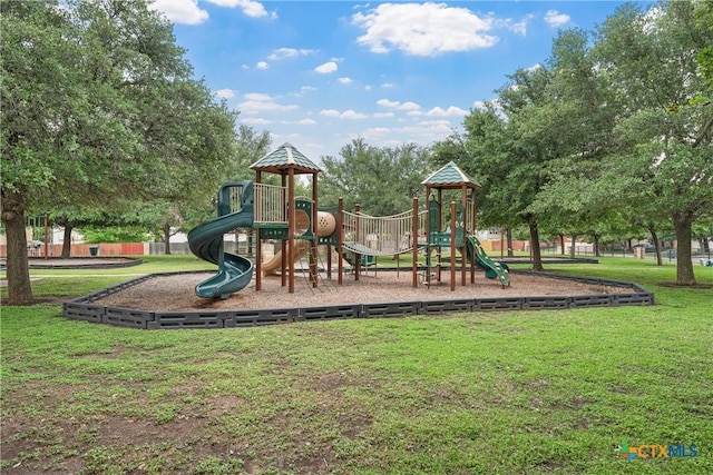 community play area with a lawn
