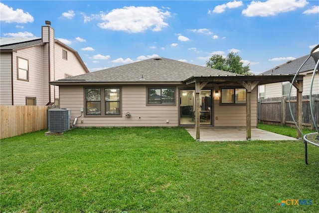 back of property with a patio, a fenced backyard, a shingled roof, and cooling unit