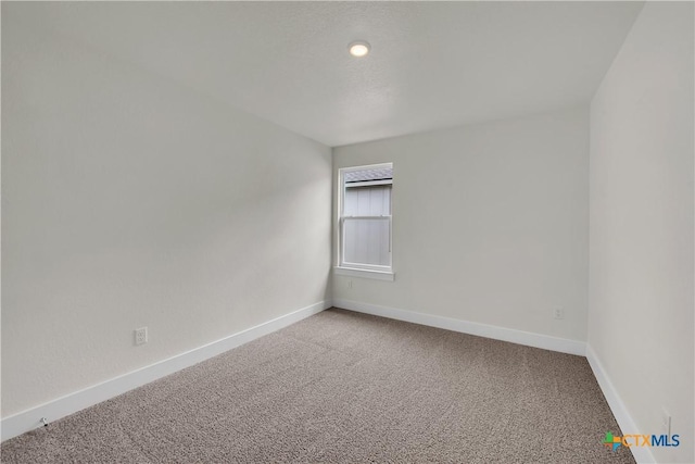 empty room featuring carpet floors