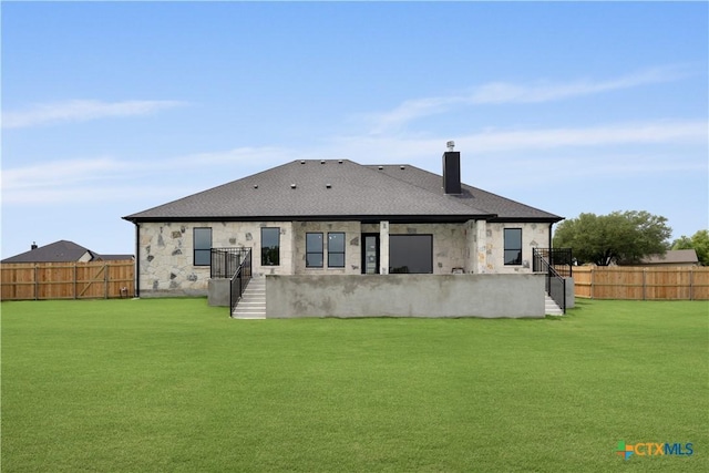 301 Canyon Oaks Rd, Troy, TX 76579 - rear view of property featuring a chimney, a fenced backyard, a yard, and stone siding