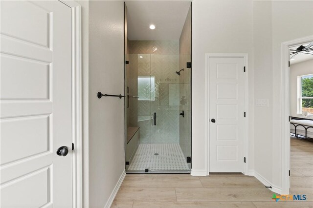 301 Canyon Oaks Rd, Troy, TX 76579 - full bath featuring baseboards, wood finished floors, and a stall shower