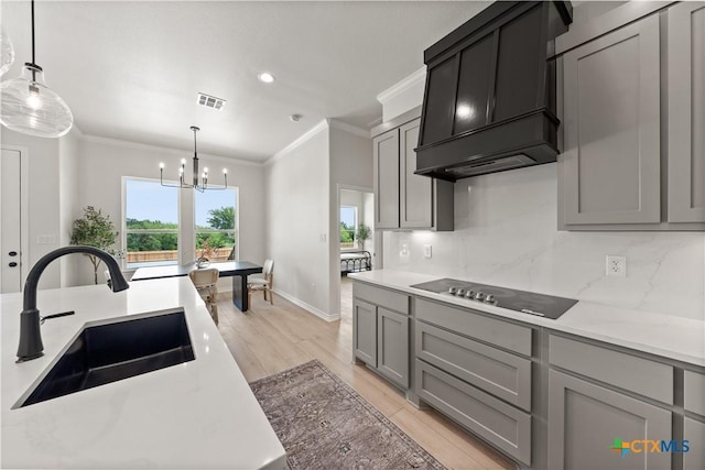 301 Canyon Oaks Rd, Troy, TX 76579 - kitchen with crown molding, a sink, black electric cooktop, and visible vents