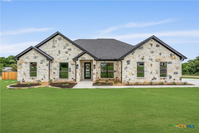 301 Canyon Oaks Rd, Troy, TX 76579 - french country home with roof with shingles, a front lawn, and stone siding