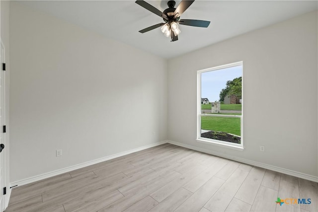 301 Canyon Oaks Rd, Troy, TX 76579 - unfurnished room featuring a ceiling fan, baseboards, and light wood-type flooring