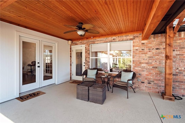 view of patio with french doors and a ceiling fan