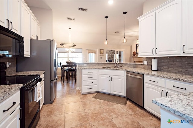 kitchen featuring visible vents, black appliances, a peninsula, white cabinetry, and a sink