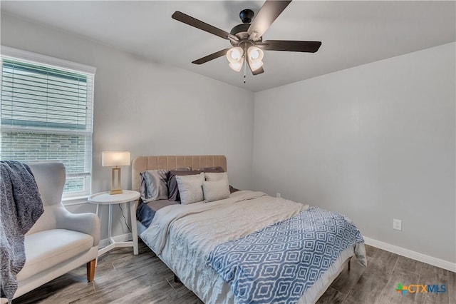 7611 Iridium Dr, Killeen, TX 76542 - bedroom with wood finished floors, baseboards, and a ceiling fan