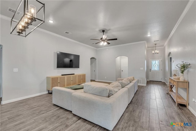 7611 Iridium Dr, Killeen, TX 76542 - living area with arched walkways, wood finished floors, a ceiling fan, baseboards, and recessed lighting