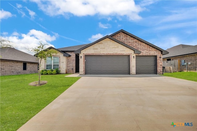 7611 Iridium Dr, Killeen, TX 76542 - french country inspired facade featuring a garage, driveway, brick siding, and stone siding