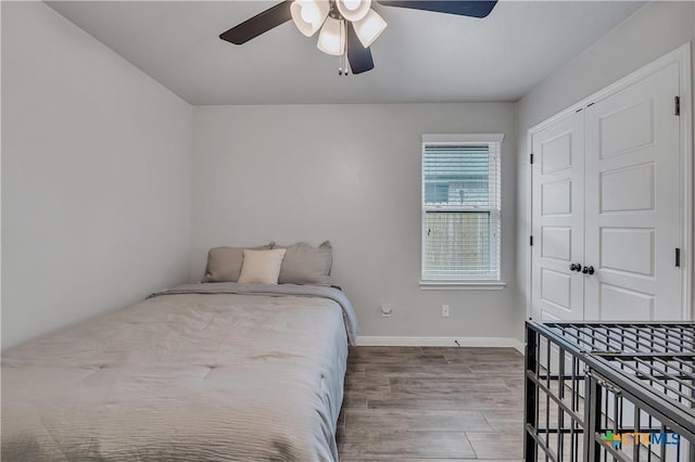 7611 Iridium Dr, Killeen, TX 76542 - bedroom featuring wood finished floors, baseboards, ceiling fan, and a closet