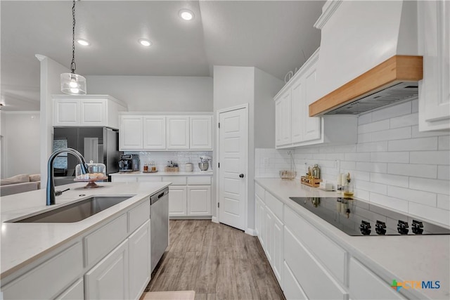 7611 Iridium Dr, Killeen, TX 76542 - kitchen with black electric cooktop, a sink, dishwasher, custom exhaust hood, and white cabinets
