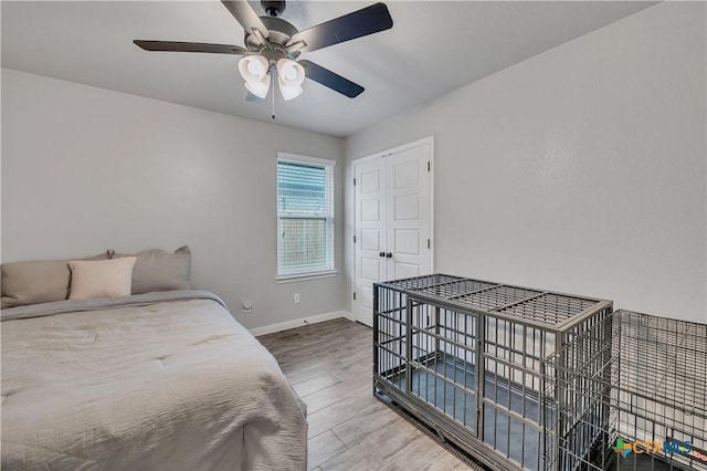 7611 Iridium Dr, Killeen, TX 76542 - bedroom with wood finished floors, baseboards, and a ceiling fan