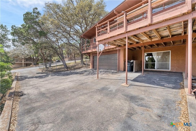 667 Fredericksburg Rd, New Braunfels, TX 78130 - view of patio with driveway and a garage