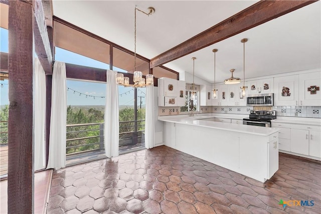 667 Fredericksburg Rd, New Braunfels, TX 78130 - kitchen with lofted ceiling with beams, light countertops, appliances with stainless steel finishes, white cabinetry, and backsplash