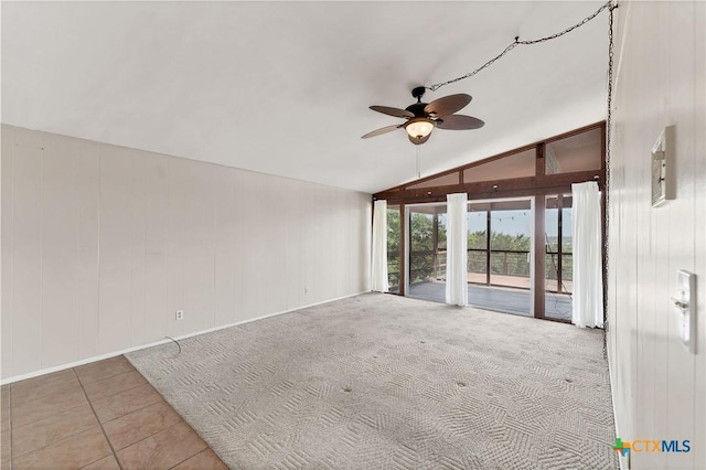 667 Fredericksburg Rd, New Braunfels, TX 78130 - carpeted spare room featuring tile patterned flooring, lofted ceiling, and ceiling fan