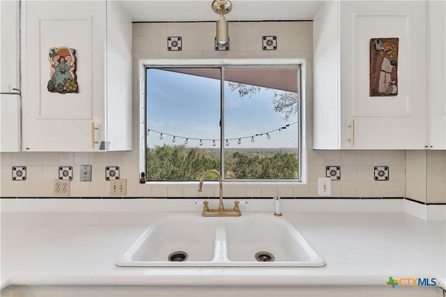 667 Fredericksburg Rd, New Braunfels, TX 78130 - kitchen featuring a wealth of natural light, white cabinets, and a sink