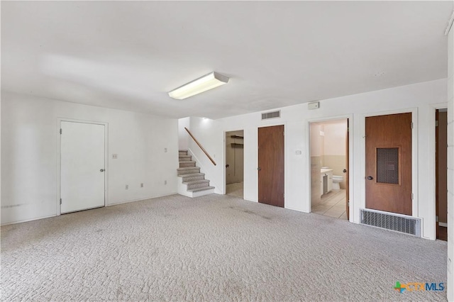 667 Fredericksburg Rd, New Braunfels, TX 78130 - basement with visible vents, carpet floors, and stairway