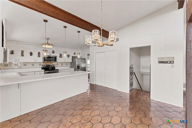 667 Fredericksburg Rd, New Braunfels, TX 78130 - kitchen featuring vaulted ceiling with beams, a chandelier, light countertops, appliances with stainless steel finishes, and a peninsula