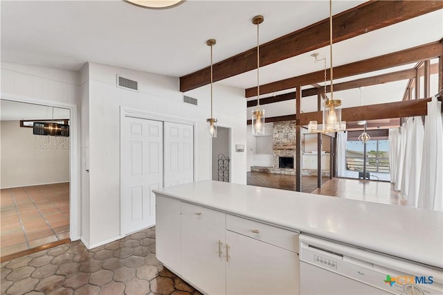667 Fredericksburg Rd, New Braunfels, TX 78130 - kitchen featuring a stone fireplace, beamed ceiling, dishwasher, and visible vents