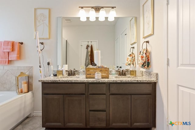 bathroom with a bathtub and vanity