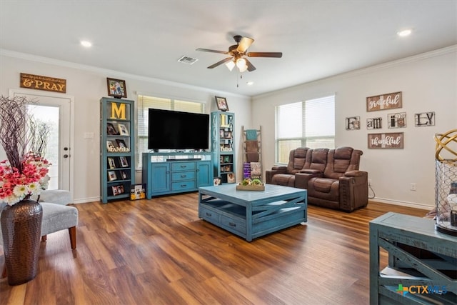 living room featuring dark wood-type flooring, ceiling fan, and crown molding