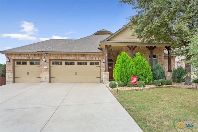 view of front of home with a garage and a front yard