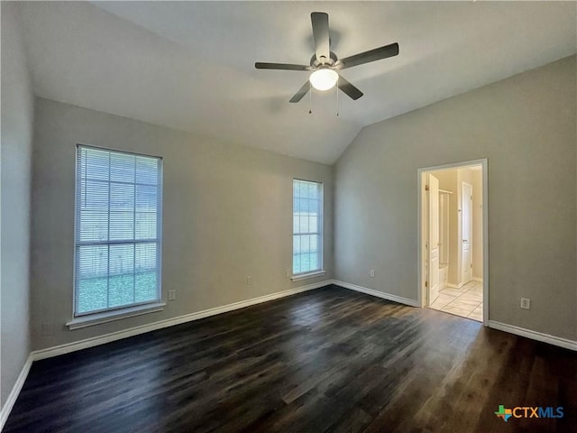 1715 Ramona Cir, San Marcos, TX 78666 - unfurnished room with dark wood-type flooring, vaulted ceiling, and ceiling fan